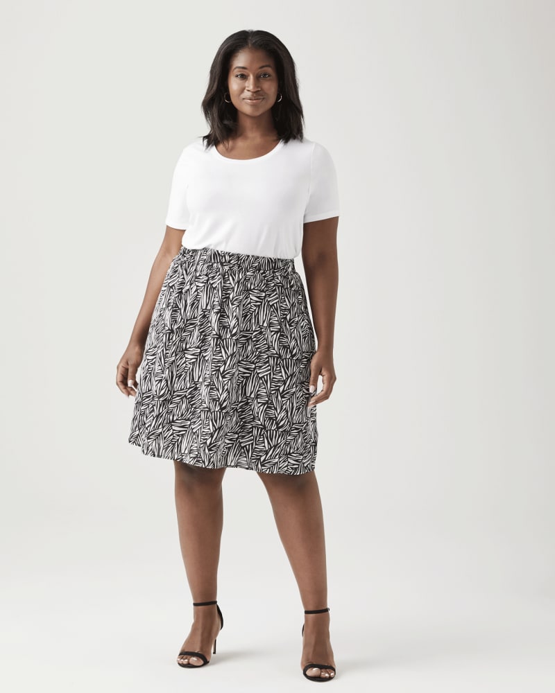 Plus size model with pear body shape wearing Orchid A-Line Flowy Skirt by Ryan Wylde | Dia&Co | dia_product_style_image_id:129393